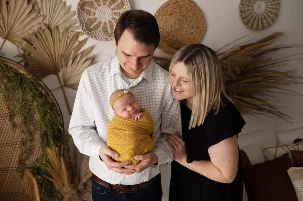 Studio family photo with newborn baby girl