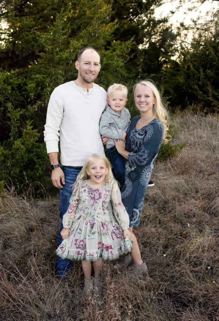 family of four smiles for family photo session