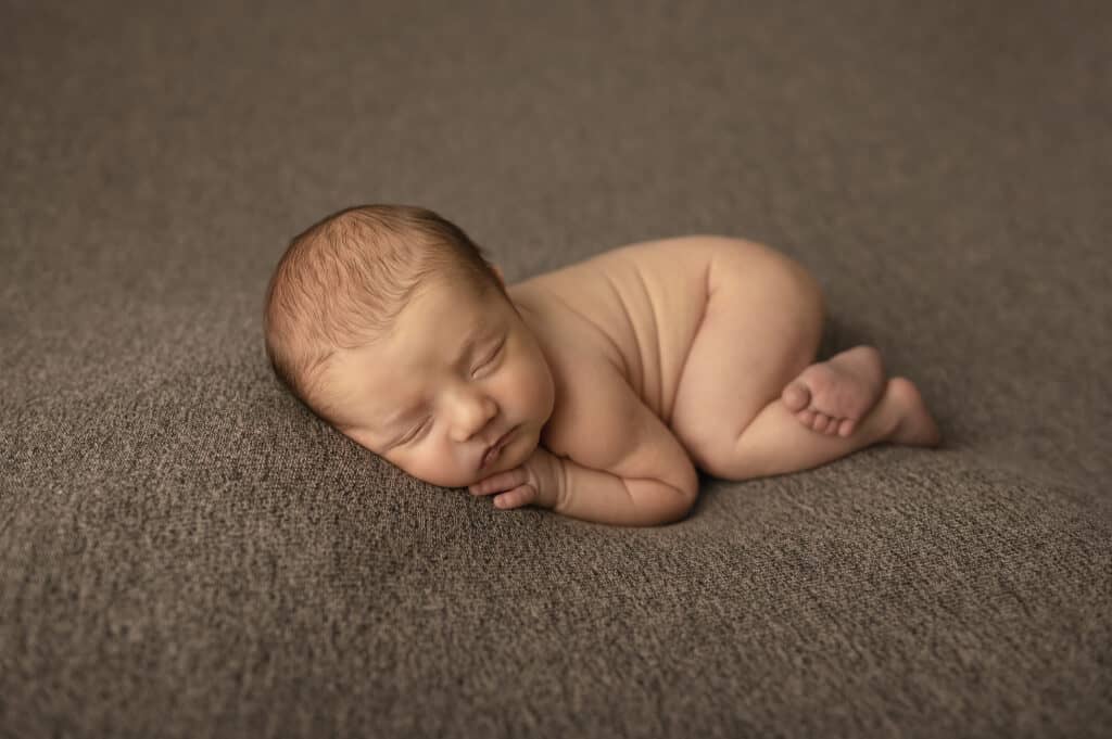 newborn photography boy sleeps with bum up