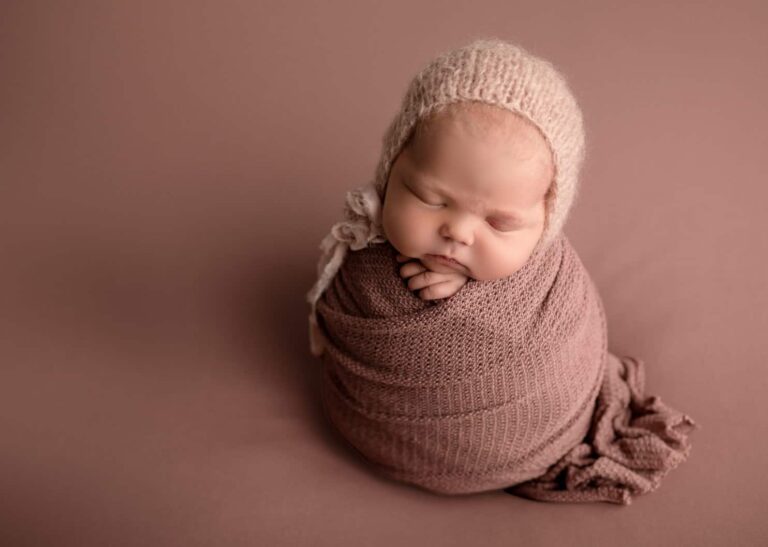 newborn-photo-session-baby-wrapped-with-bonnet