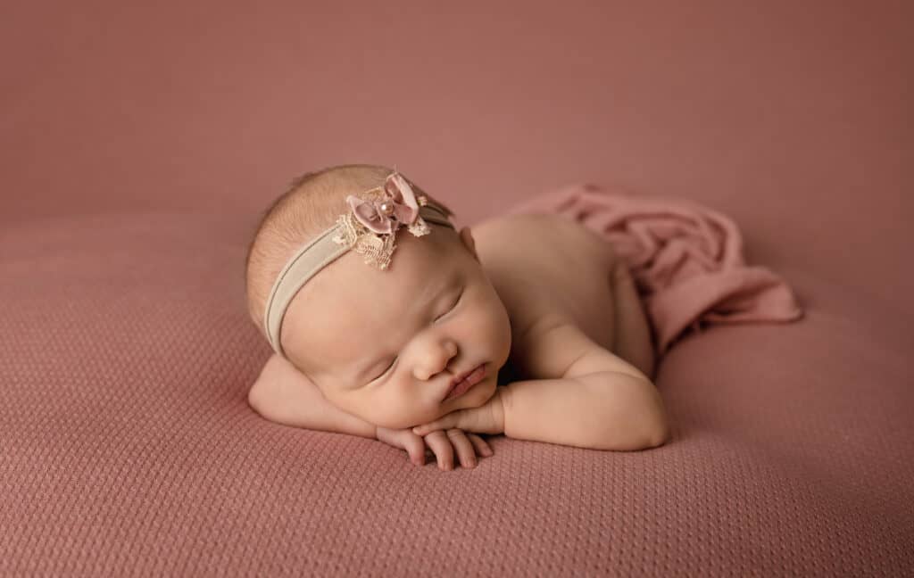 pink newborn photos baby girl sleeping