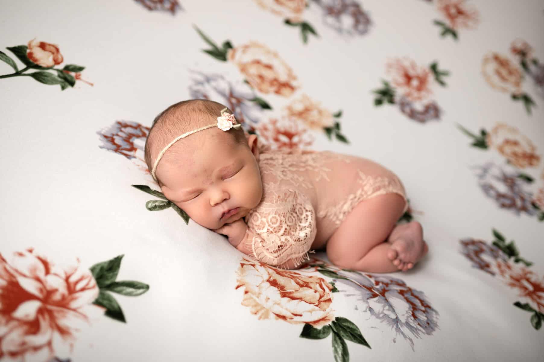 baby girl poses for Newton KS photographer Sara Nuzum