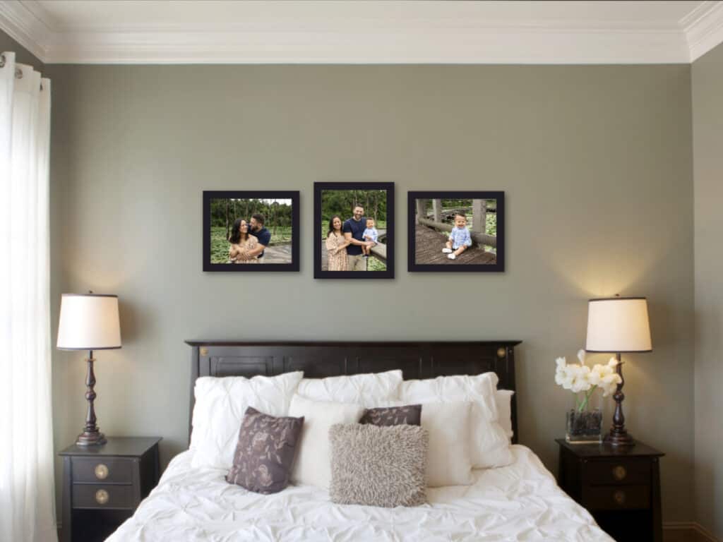 family photos hanging in master bedroom